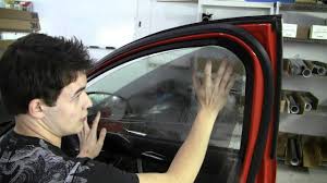 Mobile glass repair service in Brookfield - technician working on car window